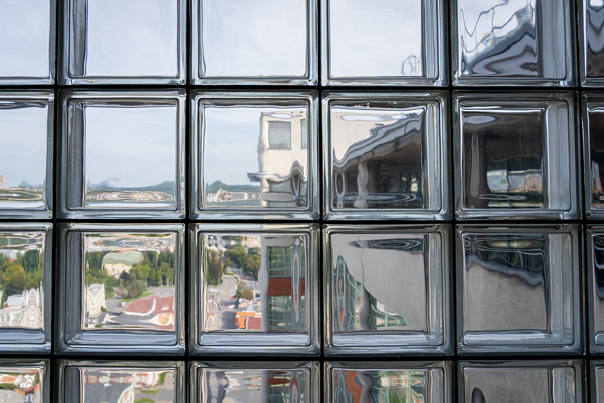 Distorted view of a town seen through glass blocks