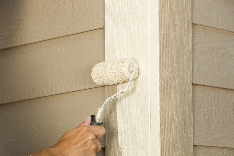 painter painting exterior house - Does Exterior Paint Have Primer In It