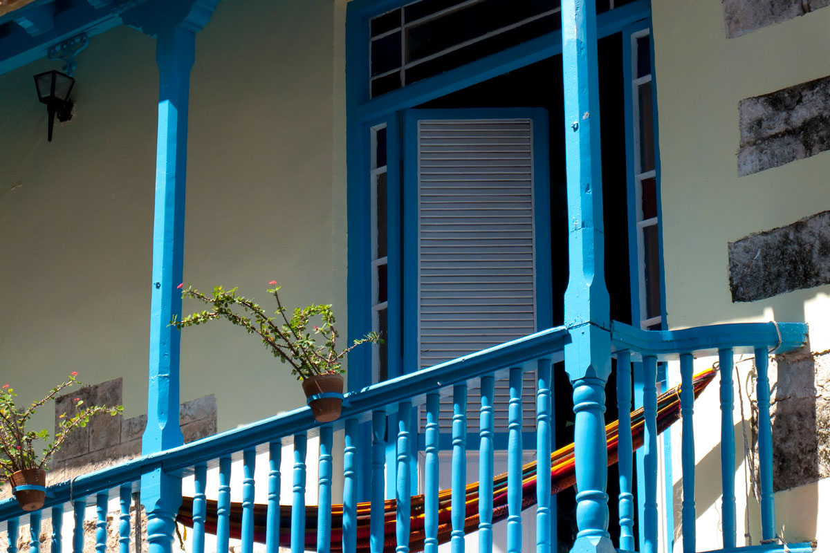 Powdered blue of a french door in a balcony
