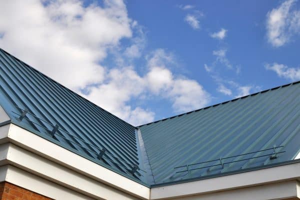 Blue metal roofing matched with white trims, Do Roof Valleys Need Mortar?
