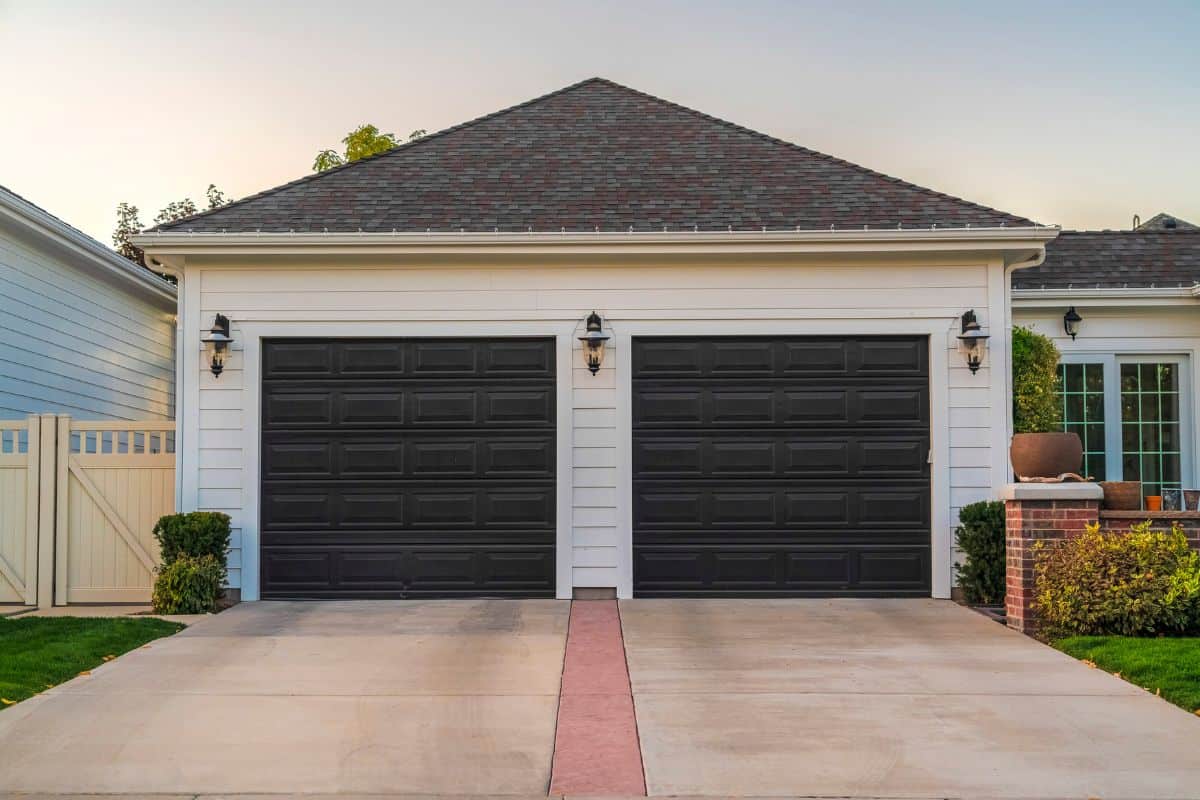 Double garage with short driveway in day.