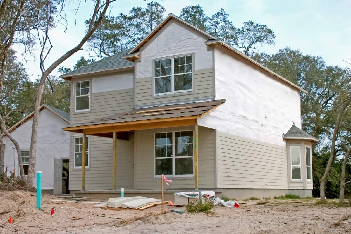 What Is A House Wrap And Why Is It Important - partially complete new home with partial application of siding