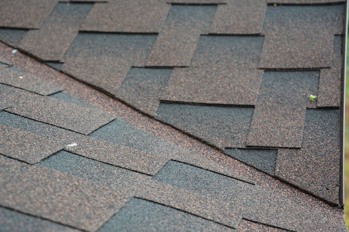 close up photo of a valley roof shingles, checkered pattern roof shingles, black and brown colored