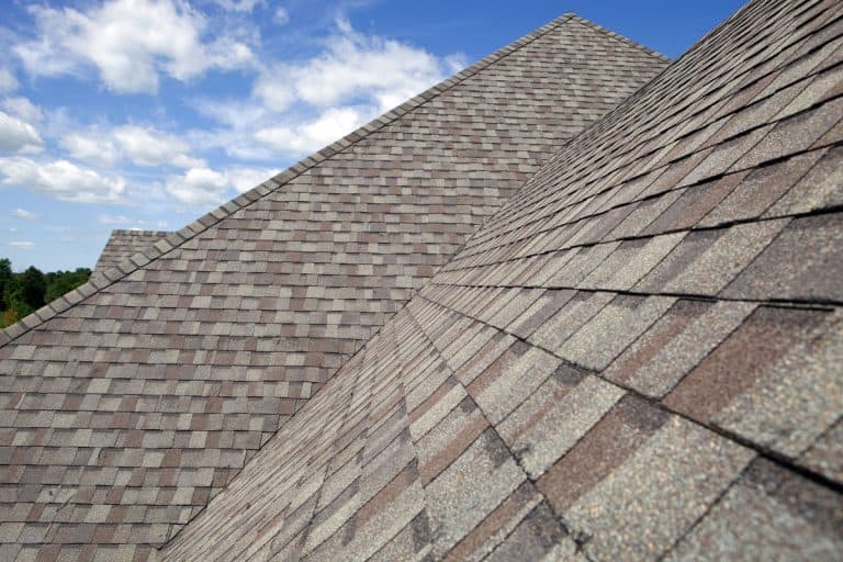 photo of a clear blue sky and a huge big roof valley, brown tone shingles, How To Waterproof A Roof Valley