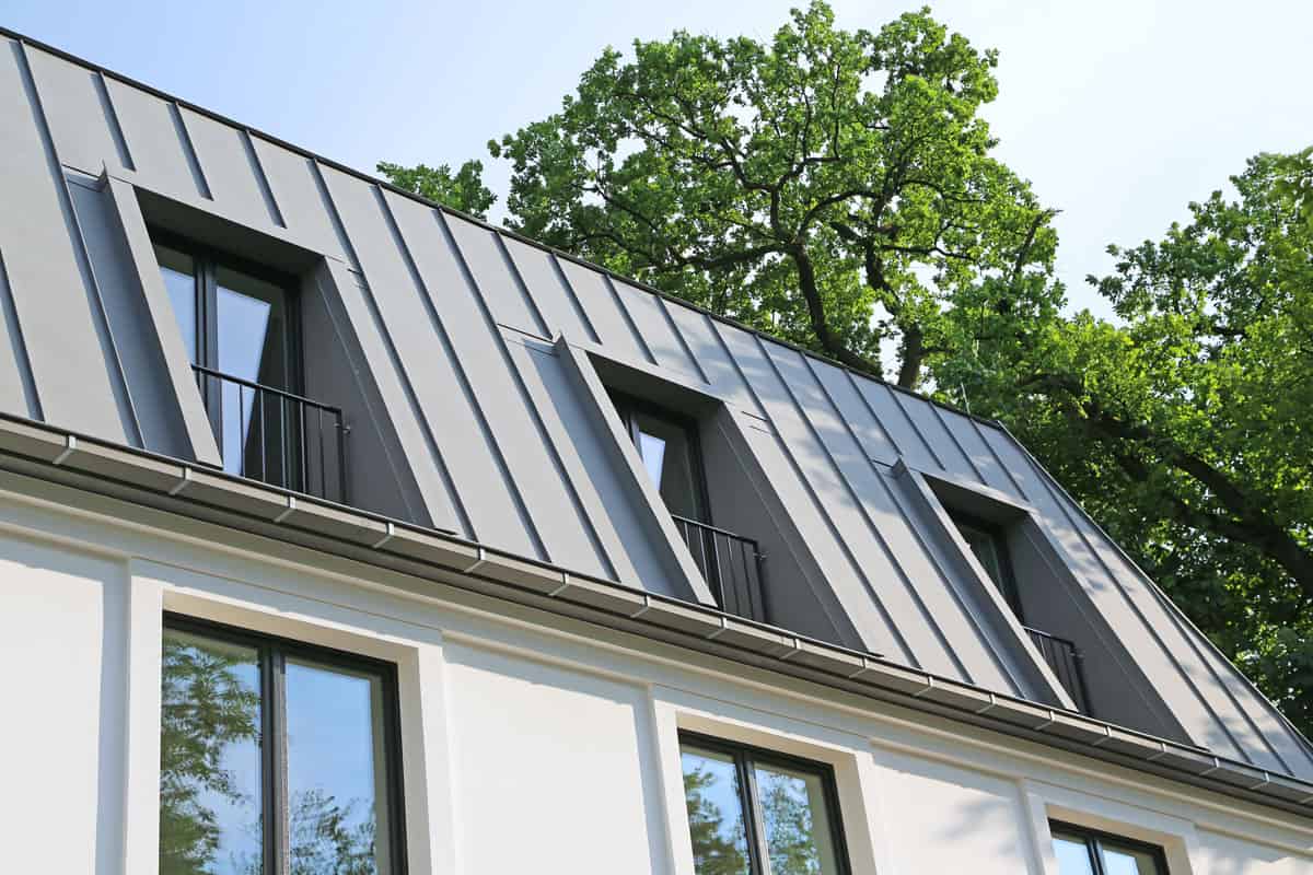 photo of a zinc roof of a modern house, grey painted zinc roof
