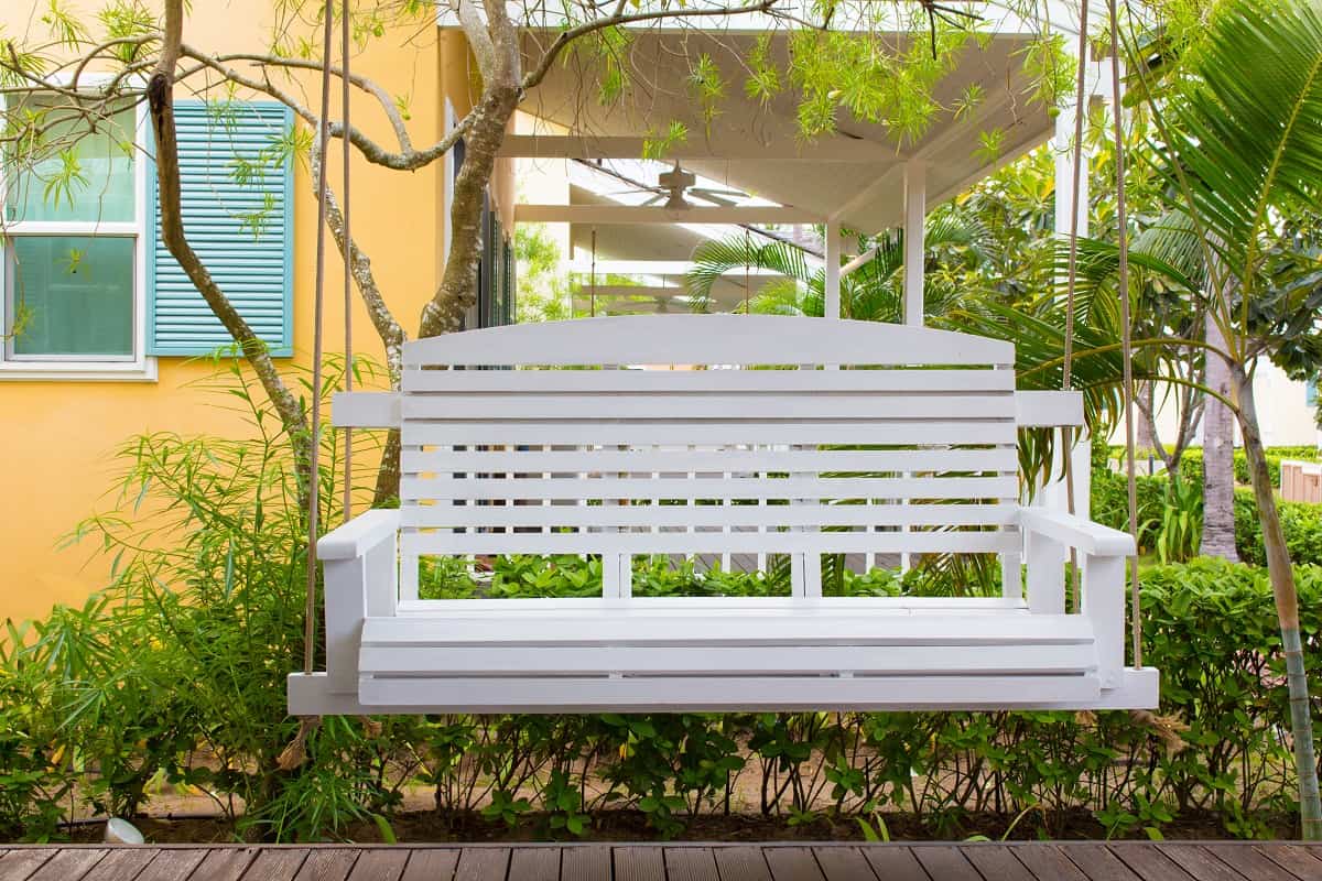 How Do You Install A Porch Swing With Springs - Front porch with a white porch swing,relax corner