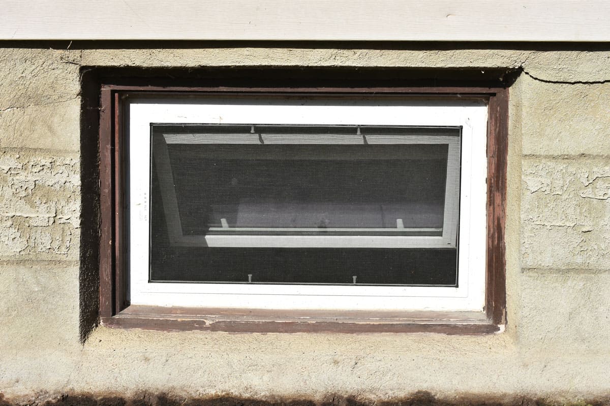 Old Brown and White Basement Window