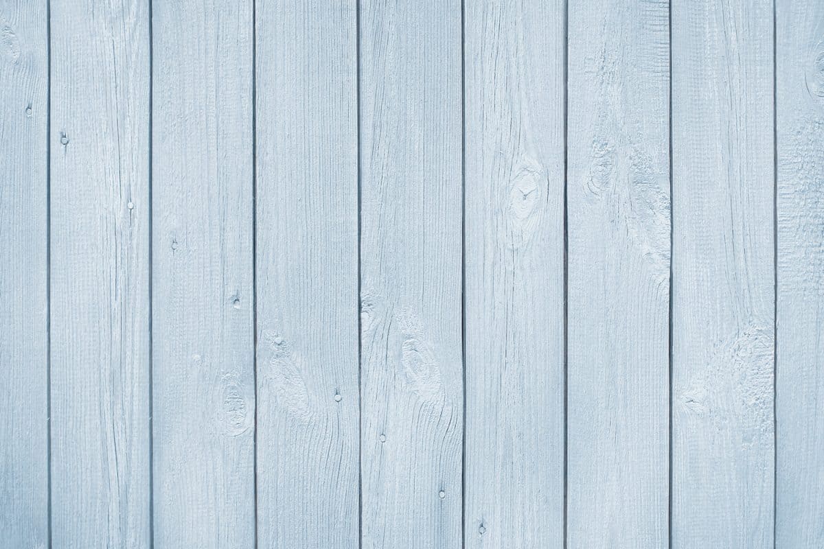 Painted light blue grey pastel wood background texture
 
