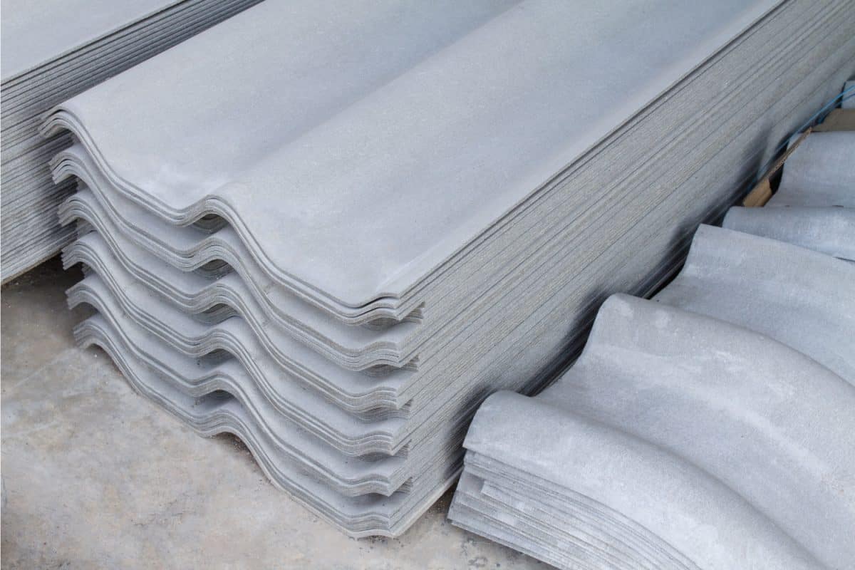Stack of new roof tiles sheet Asbestos Concrete fiber cement and Siding Standard gray color.