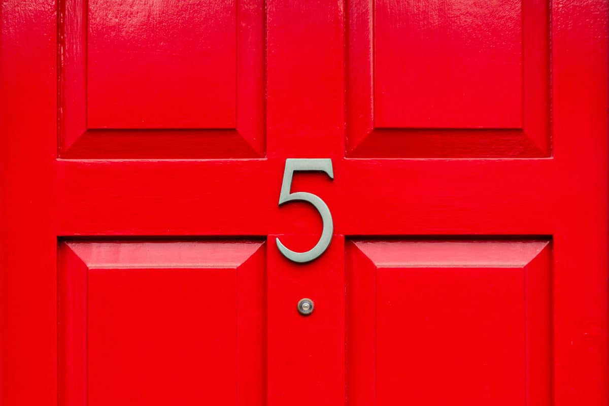 photo of a bright-red-front-door-house-number