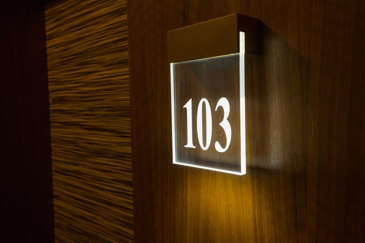photo of a hotel-room-number-on-wooden-wall