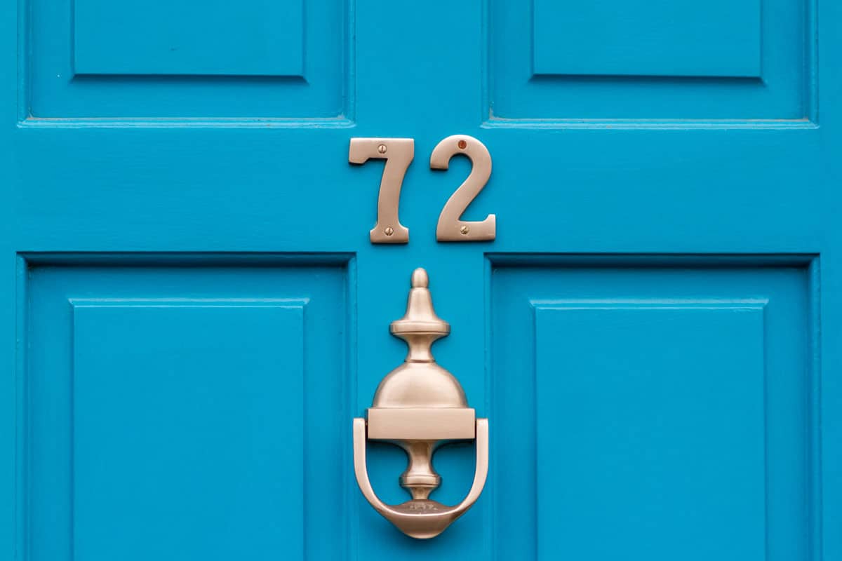 photo of a house-number-72-on-beautiful-blue