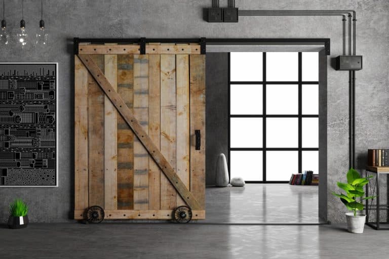 Modern interior in loft style barn sliding wooden door in loft room, Do Sliding Doors Need Wheels?