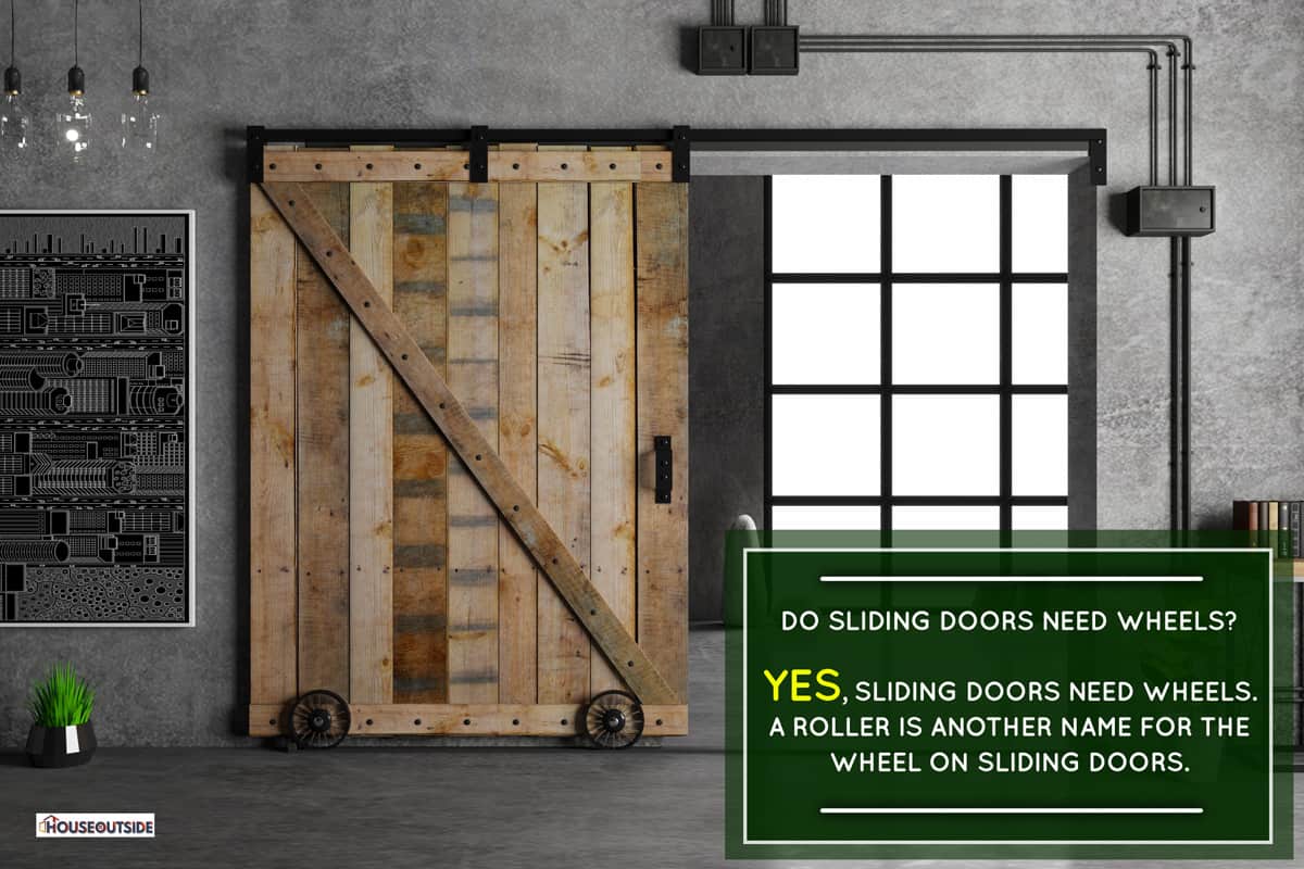 Modern interior in loft style barn sliding wooden door in loft room, Do Sliding Doors Need Wheels?