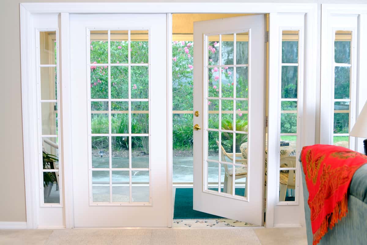 Open white French doors without curtains